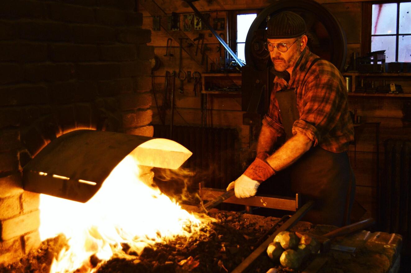 Joel Sanderson does metalwork out of his blacksmith shop near Quincy, Michigan. 